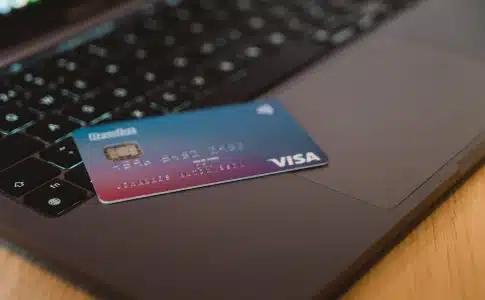 blue and white visa card on silver laptop computer